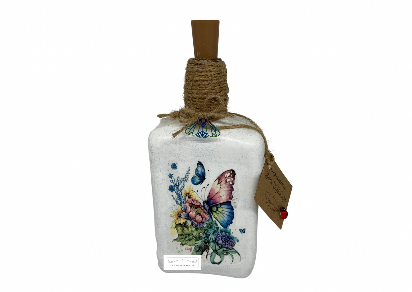 Decoupaged Light Up Bottle With A Variety Of Different Designs