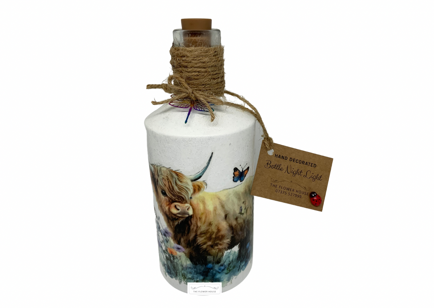 Decoupaged Light Up Bottle With A Variety Of Different Designs