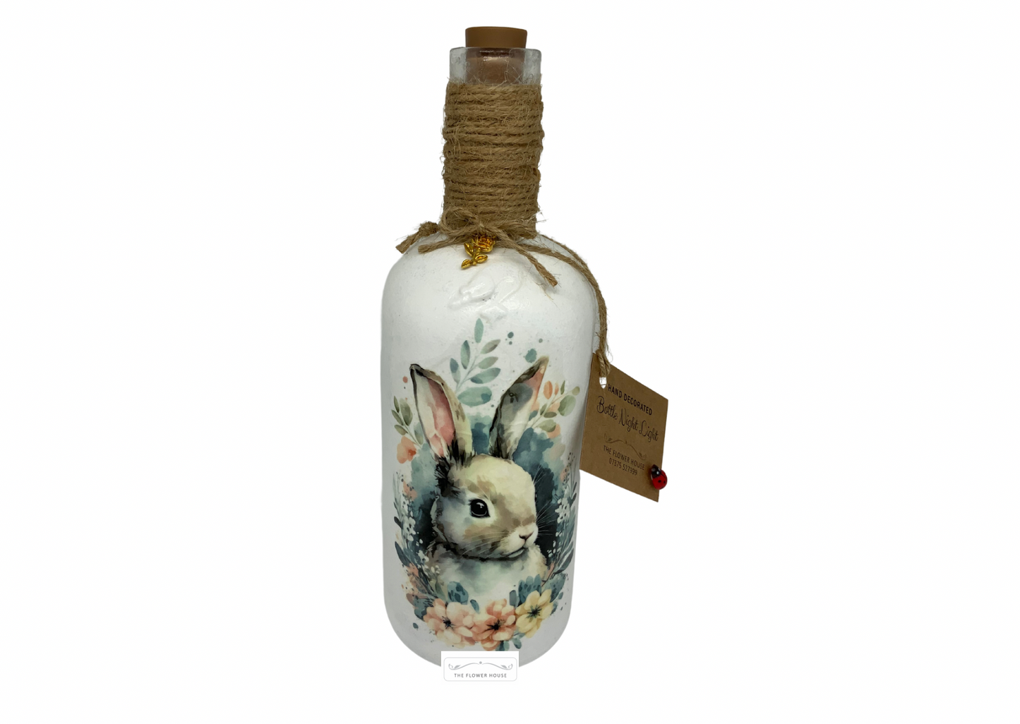 Decoupaged Light Up Bottle With A Variety Of Different Designs