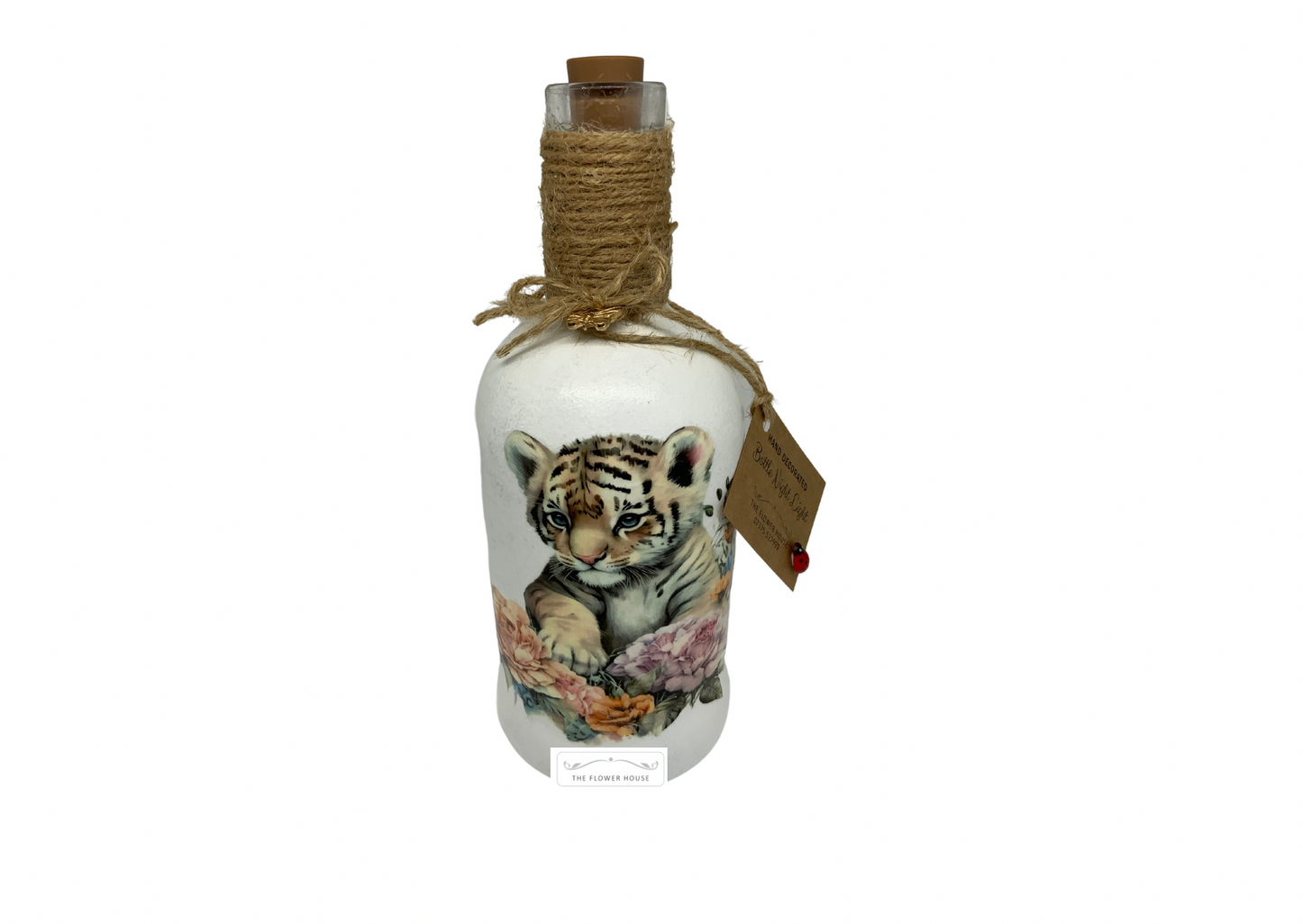 Decoupaged Light Up Bottle With A Variety Of Different Designs